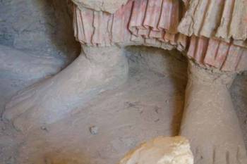 The feet of a Buddha figure on the Mes Aynak site