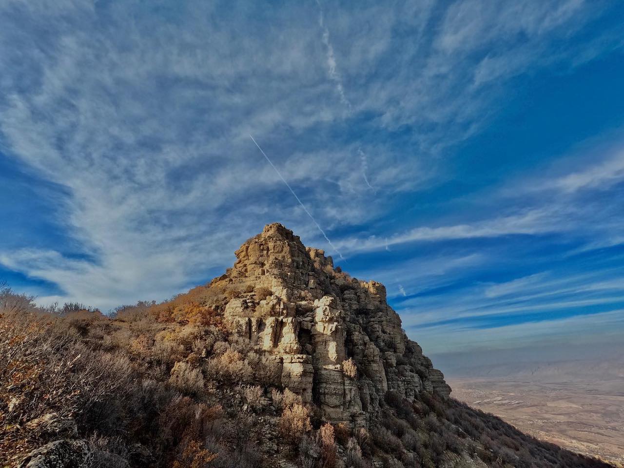 a mountain peak and a blue sky